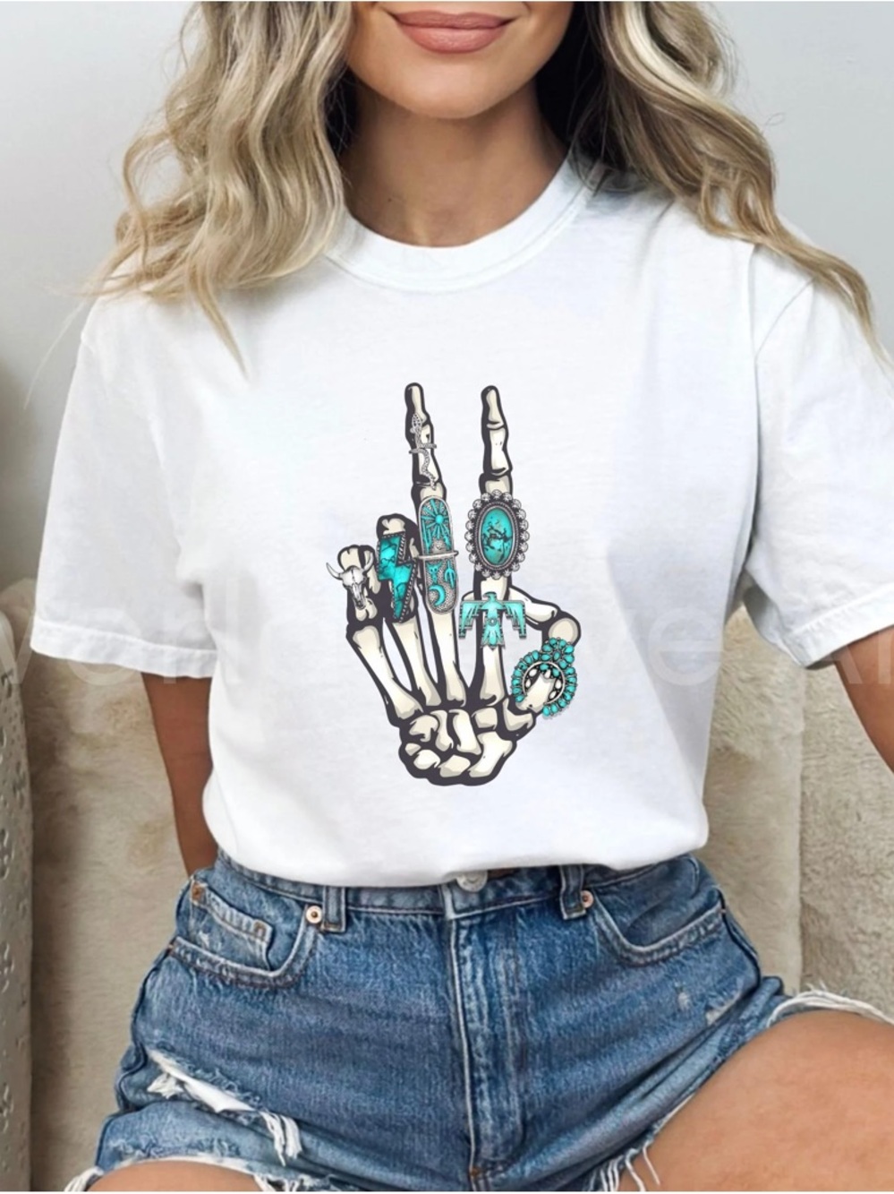 White Graphic Tee with Turquoise Skeleton Hand Design